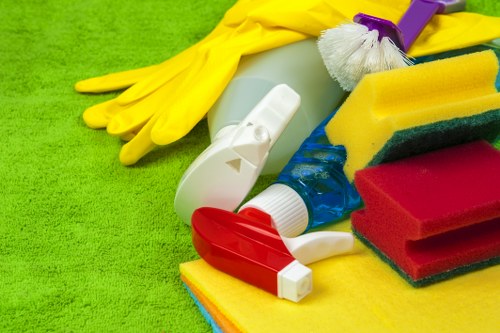 Cleaner maintaining stairwell and communal surfaces in Barnes